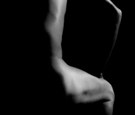 Abstract Figure Line Black and white bodyscape of Larry’s torso, arm, hip, and leg arranged in an abstract pose against a dark background.